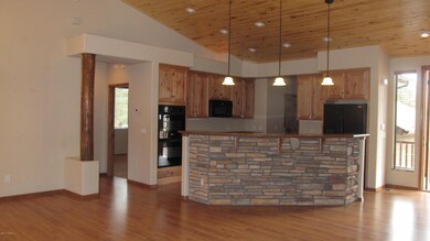 Gourmet kitchen with stone accents