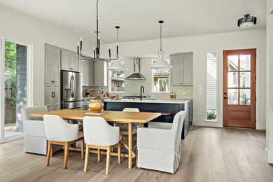 Kitchen featuring stainless steel fridge, wall ch