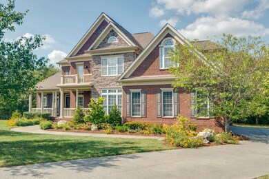 Notice the brick & stone detailing on the front elevation, multiple roof peaks, and custom architectural details.  The yard has full irrigation to keep this beautiful look all summer long.