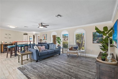 Living room with ceiling fan, hardwood / wood-styl
