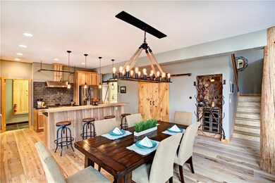 SPECTACULAR!  The open dining area is stunning.  Through the door left of the kitchen is a convenient mudroom with storage.