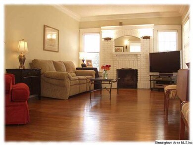 View of the living room and fireplace from the din