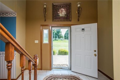 A tiled 2-story entry welcomes family and friends 