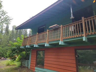 View of property exterior featuring a balcony