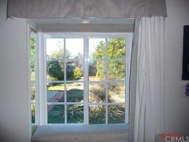 Window seat with views into private front yard.