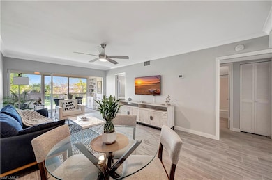 Dining space with light wood-type flooring and cei