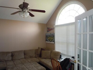 Vaulted ceiling, circle top window, French doors