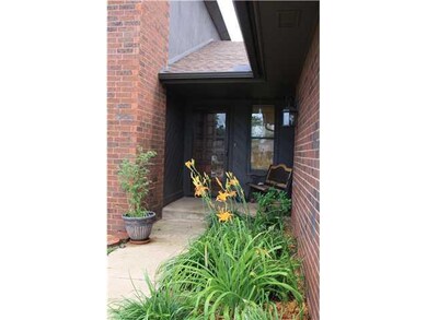 Exterior Front. Entry - new landscape in flower be