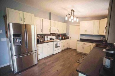 Kitchen with new stainless steel refrigerator
