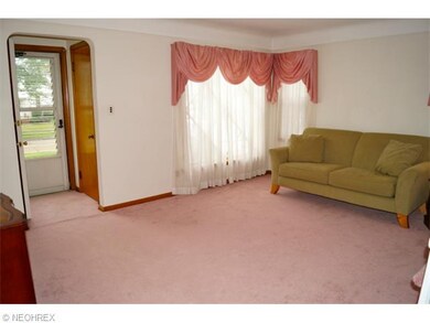 Hardwood under this pink carpet. Carpet is in good condition if you prefer it.