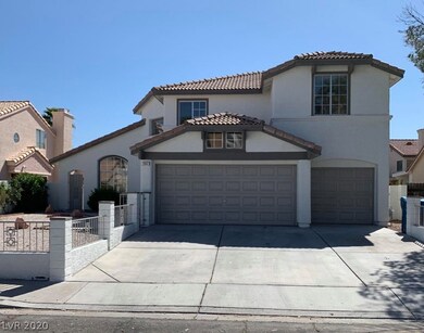 FRONT OF HOME. 3 CAR GARAGE. EXTRA WIDE DRIVEWAY.L