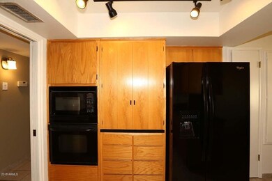 Baking center behind upper cabinet