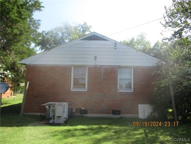 View of home's exterior featuring a yard