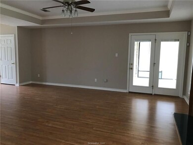 Unfurnished living room featuring dark wood finish