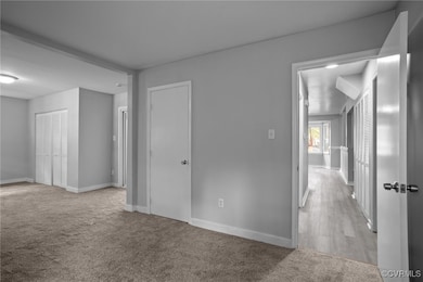 Spare room with carpet flooring and baseboards