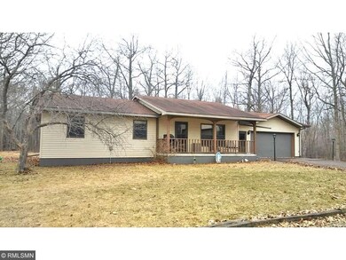 Spring picture of front of home with attached gara