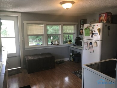 Back door comes into the kitchen.  Windows over lo
