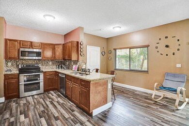 Remodeled kitchen with cherry wood cabinets, stain