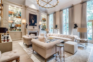 Living room featuring a high end fireplace, a nota