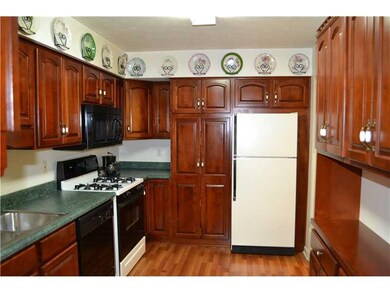 Kitchen. Beautiful cherry kitchen cabinets.  All a