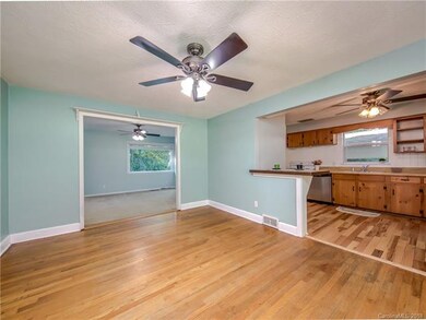 Cheerful open-concept floorplan integrates the kitchen and living areas.