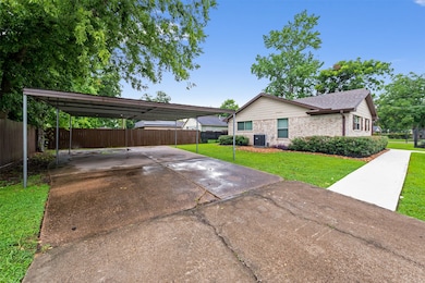 Daytime front view with manicured lawn and large s