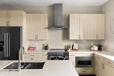 Kitchen w/ undermount microwave, induction stove, fully stocked with dish ware, spices, cooking ware, and more!