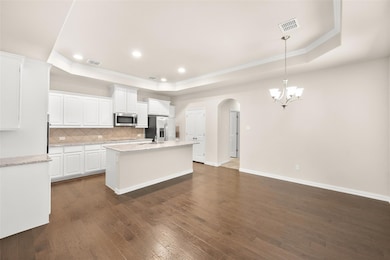 Kitchen featuring stainless steel appliances, a ra