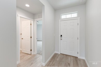 Entrance foyer featuring light wood-type flooring