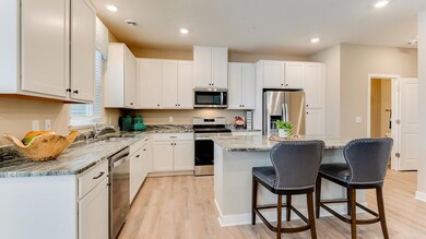 Beautiful 42' cabinets with hardware and granite countertops in every home. Image is of model, colors may vary.