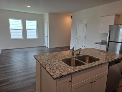 Kitchen with stainless steel appliances, a sink, 