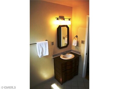 Bathroom - Upstairs bath has tile flooring and ele