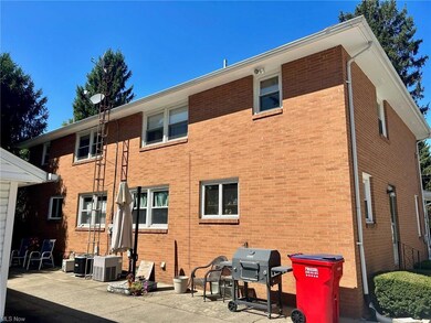 Rear view of house featuring a patio and central air condition unit