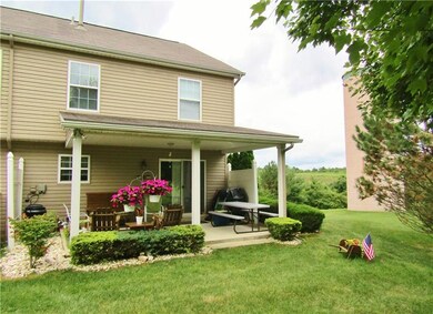 THE SIZABLE CONCRETE PATIO IS THE PERFECT PLACE TO