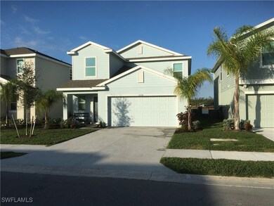 View of front of house with a garage and a front l