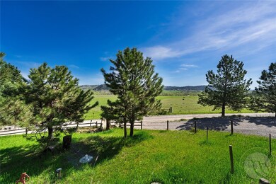 Front yard with split rail fence and views to the
