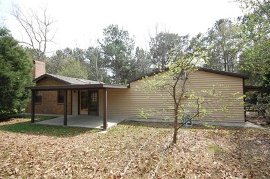 Left side of house with patio.