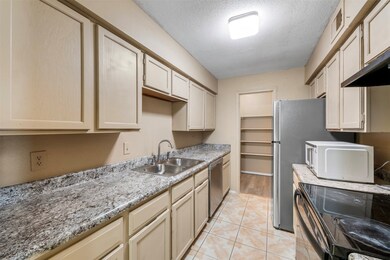 Cozy galley kitchen with plenty of countertops, am
