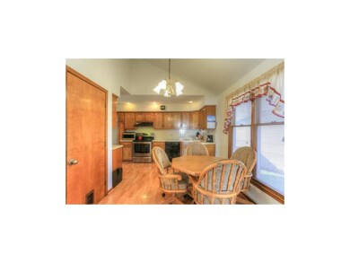 Eat in kitchen features laminate and window overlo