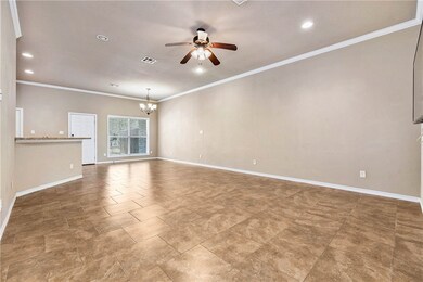 Unfurnished living room with baseboards, recessed
