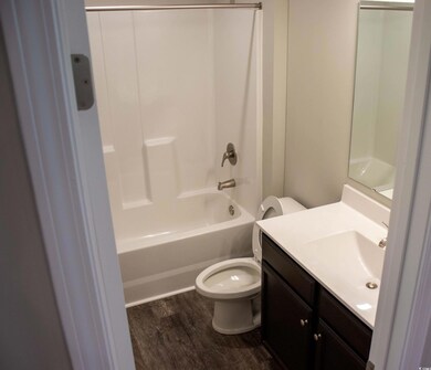 Full bathroom with vanity, toilet, shower / bathin