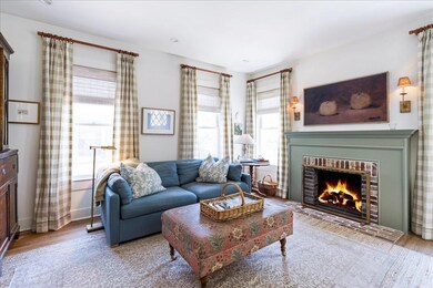 Living room with a fireplace, light wood finished