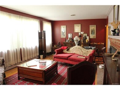 Living room with tons of natural light and a firep