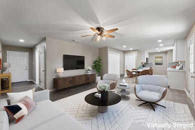 Living room featuring recessed lighting, wood fin