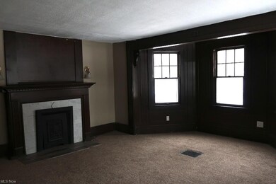 living rm w/ fp and bay window