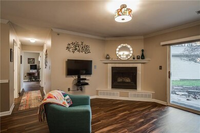 Cozy family room with corner gas fireplace & updat