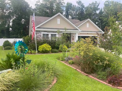 Craftsman-style home with a front yard