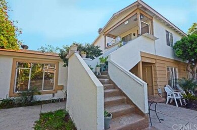 Steps to upper unit, and kitchen breakfast area wi