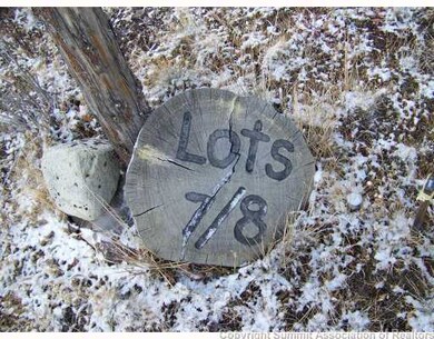 Exterior Front. Wooden marker-located at the corne