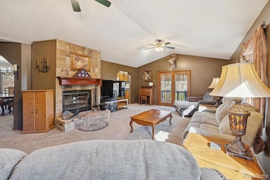 Bright and open living area with multiple windows and French doors leading to the back deck.